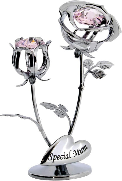 Silver rose with pink gemstones on a white background