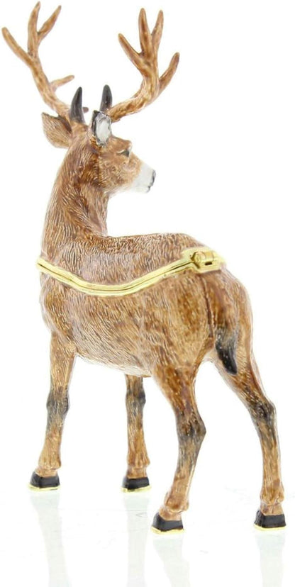 Deer figurine with a gold harness on a white background