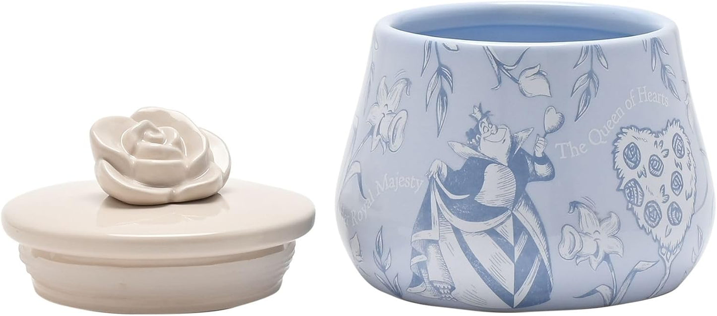 Ceramic container with lid featuring floral and character design on a light blue background