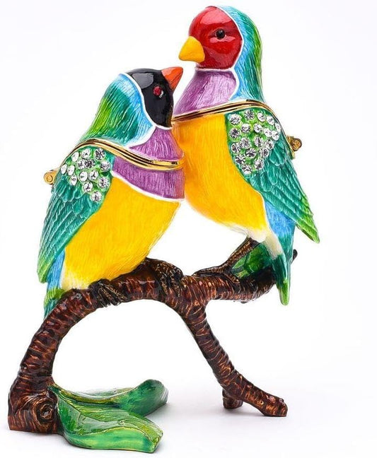 Colorful bird figurine on a branch with decorative elements