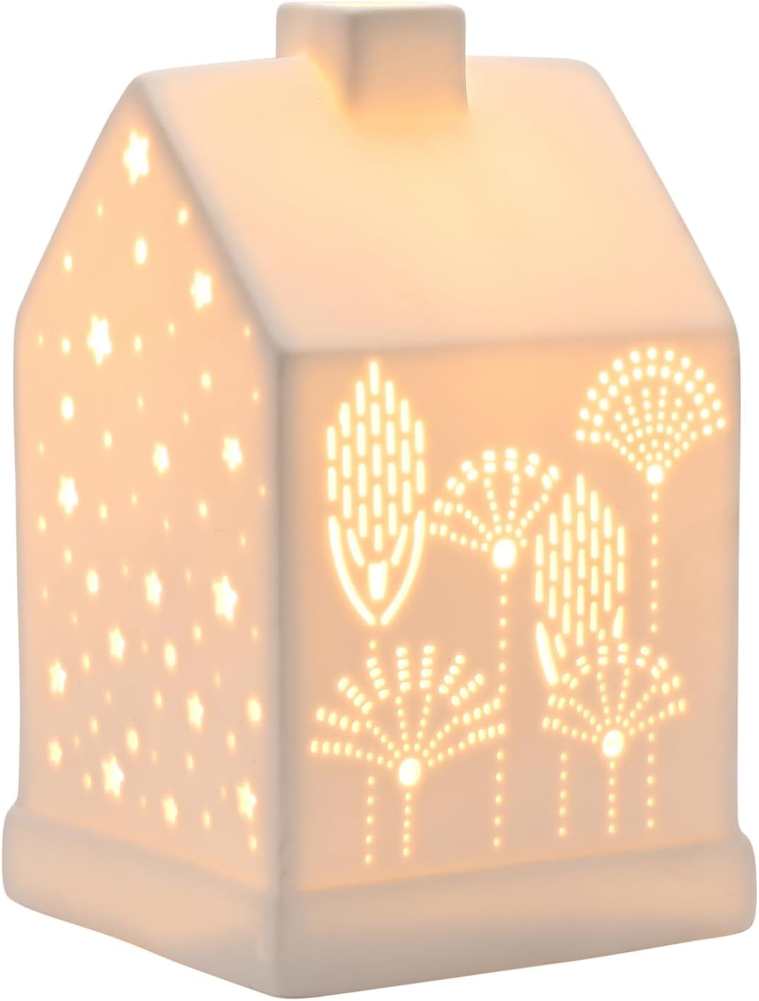A small house-shaped ceramic night light glowing with warm light, featuring laser-cut star and leaf patterns on the front and side.