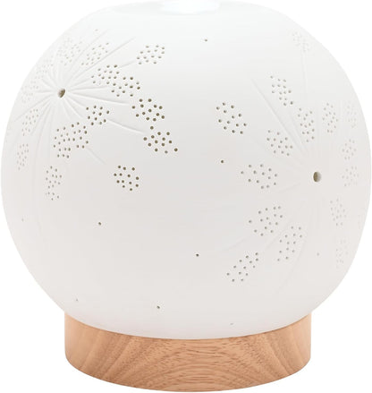 A white spherical lamp with laser-cut floral patterns, resting on a light natural wood base against a white background.