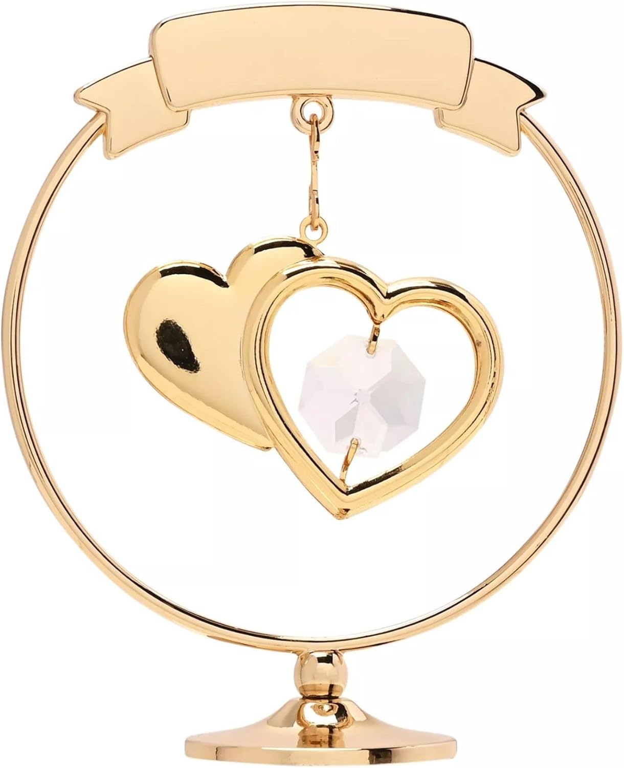 Gold heart-shaped ornament with a white center on a white background