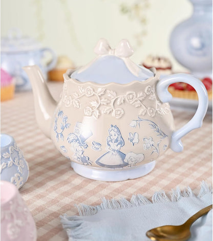 Decorative teapot with floral patterns on a tablecloth