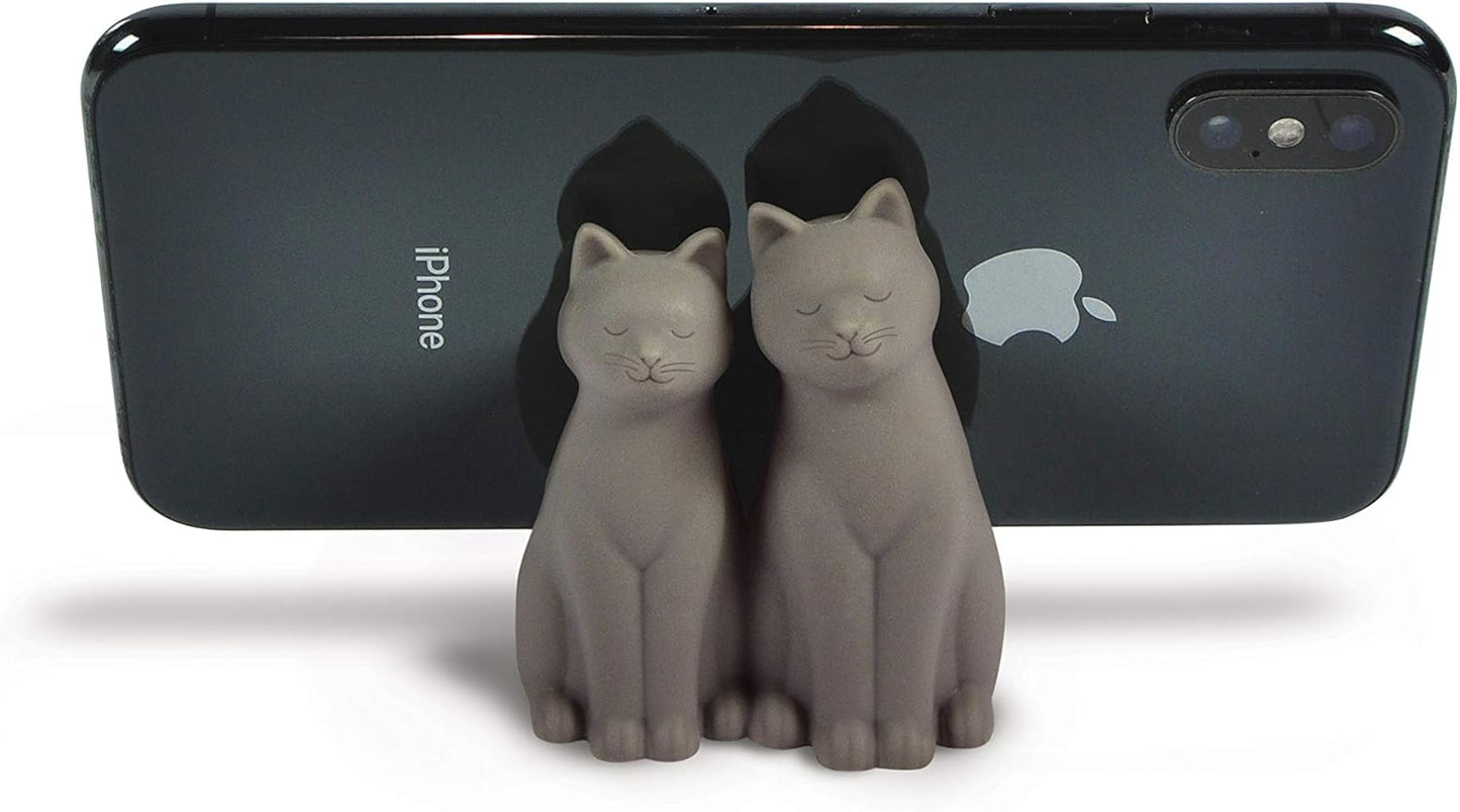 Two gray cat figurines in front of an iPhone with Apple logo.