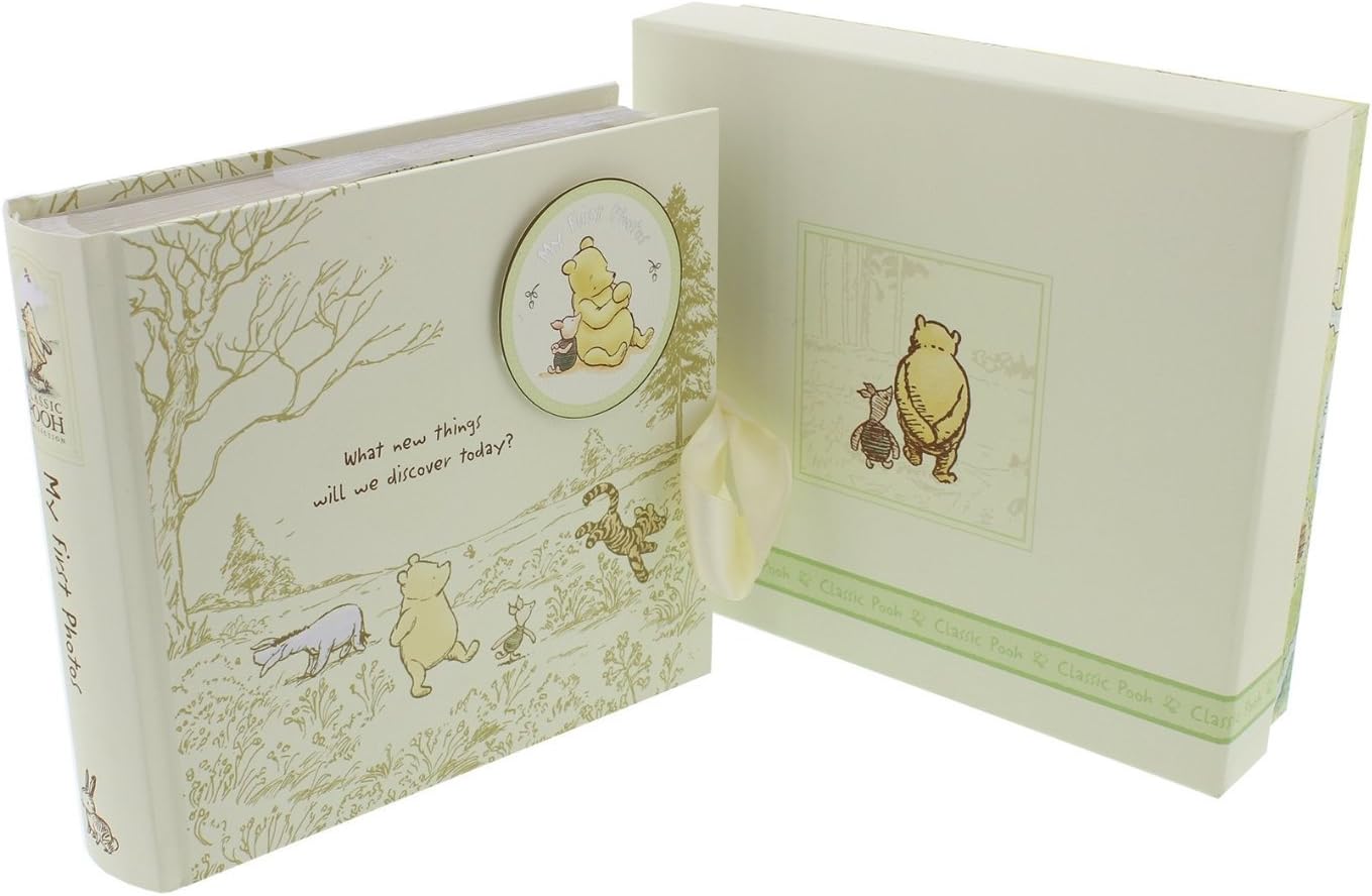 Open book with illustrations of Pooh and friends on a white background