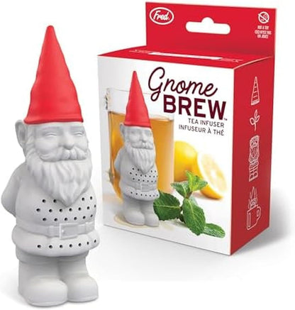 Gnome-shaped tea infuser with red hat next to its packaging on a white background