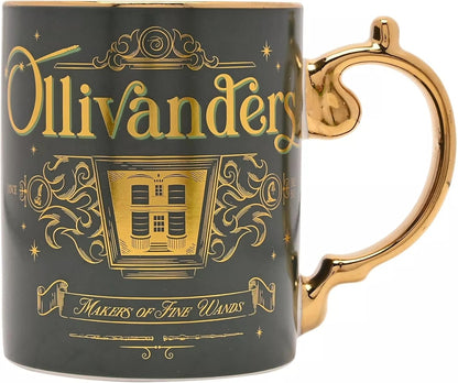 A dark green ceramic mug with a shiny gold handle and gold printed design featuring the text 'Ollivanders' and 'Makers of Fine Wands' on a white background.
