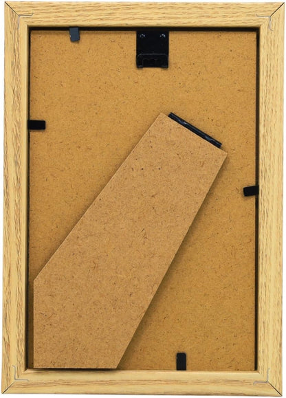 Backside of a wooden picture frame with cardboard insert