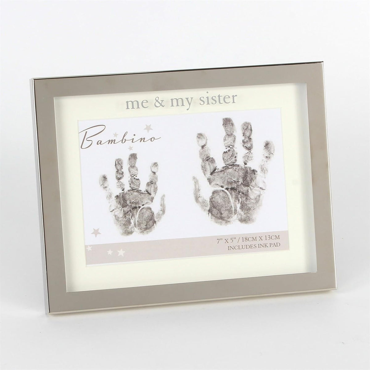 Framed handprint kit with 'me & my sister' text and handprints on a white background