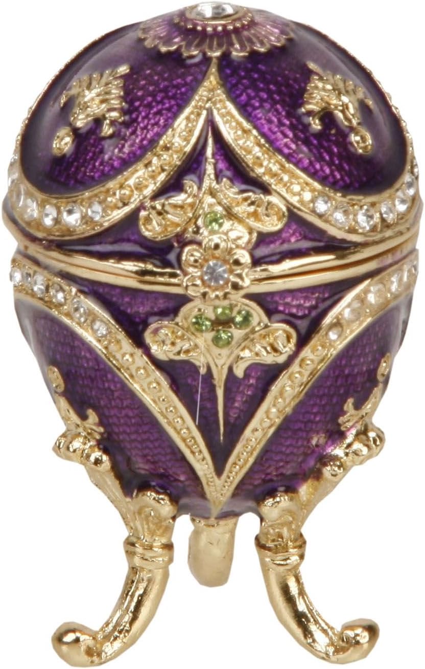 Decorative purple egg with gold accents on a white background