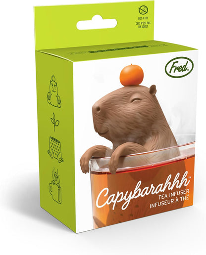 Capybara-shaped tea infuser with packaging on a white background