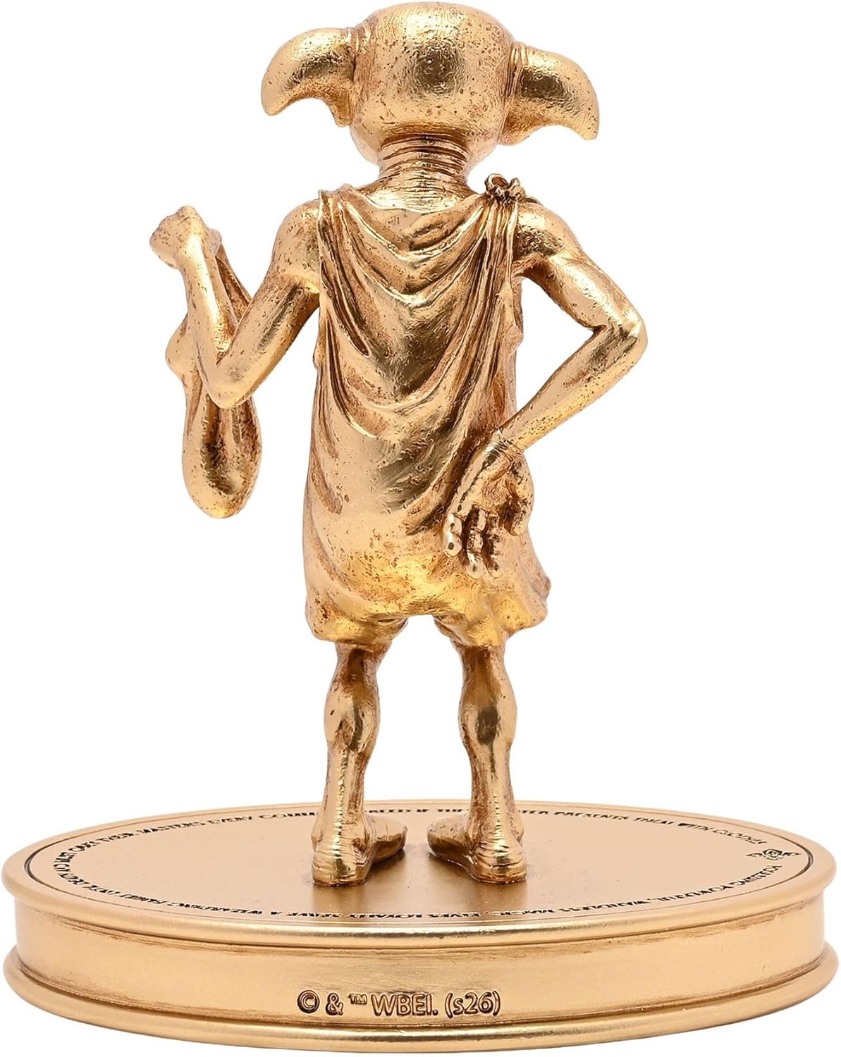 Gold figurine of a creature on a white background