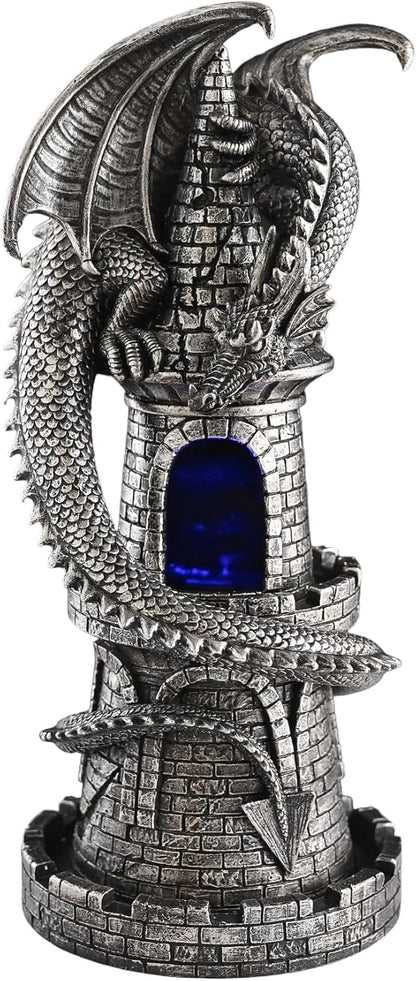 Decorative dragon sculpture with a blue light inside a tower