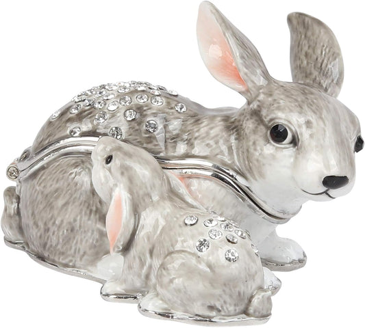 Decorative rabbit-shaped box with crystals on a white background