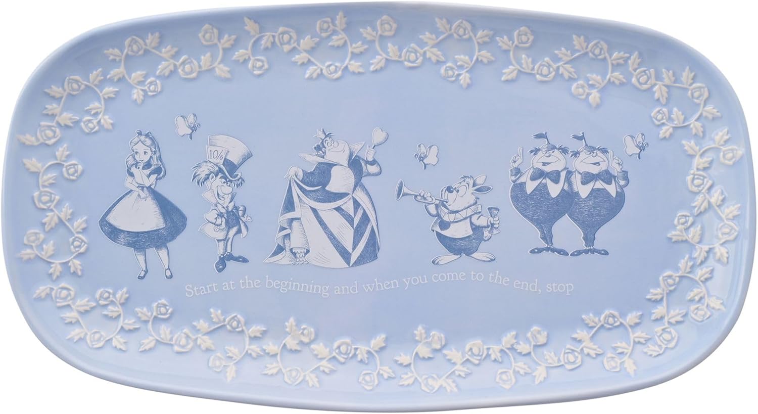 Decorative plate with animated characters and floral patterns on a light blue background