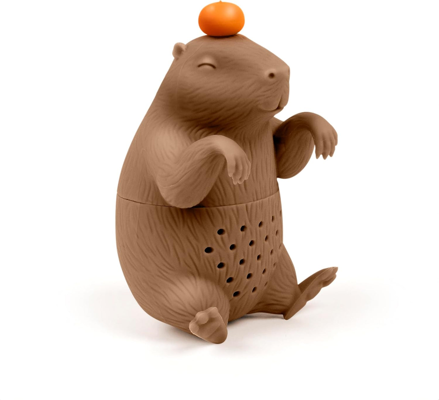 Brown animal-shaped tea infuser with an orange on its head on a white background
