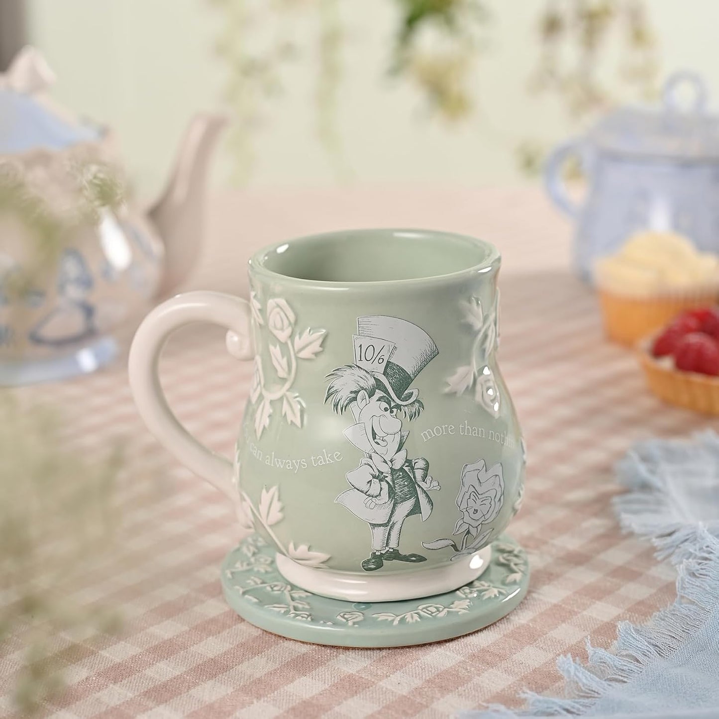 Green mug with character design on a table with a blurred background