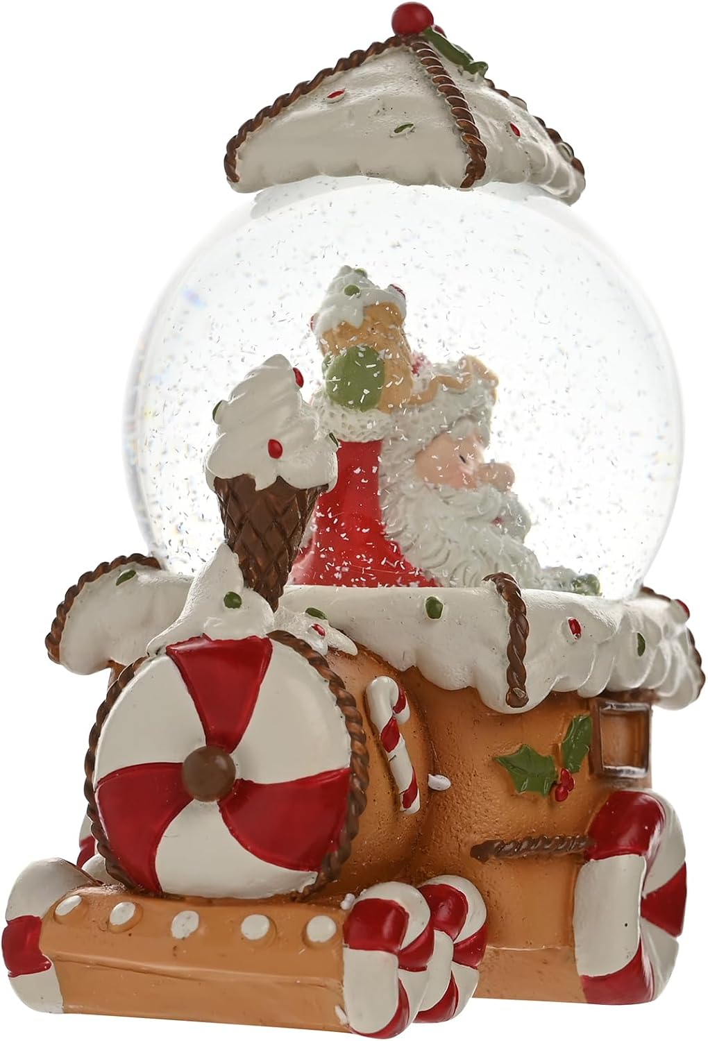 A Christmas-themed snow globe figurine featuring Santa Claus and a gingerbread train decorated with candy canes, white icing details, and red and green holiday accents, shown on a plain white background.