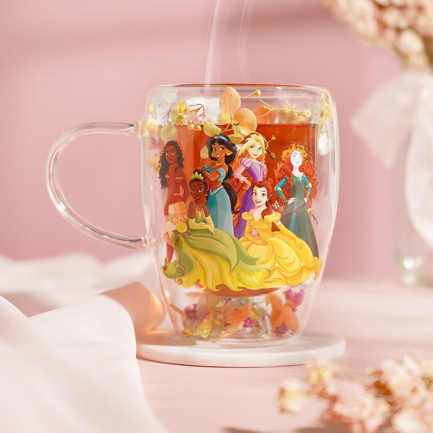 Clear mug with Disney princesses design on a pink background