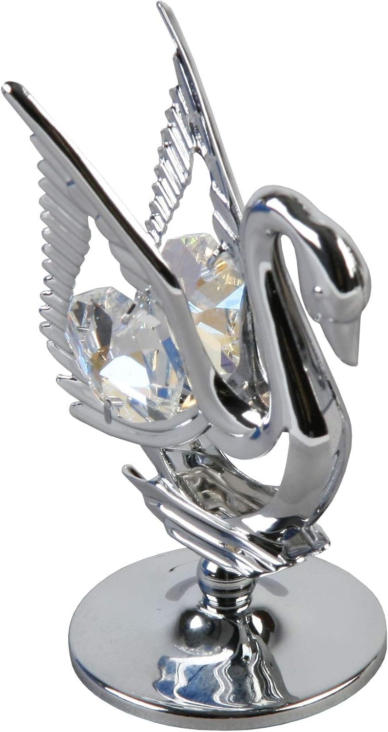 Metallic swan figurine with crystal in the centre on a white background