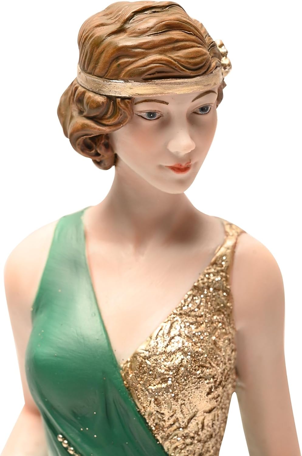 Statue of a woman in a green and gold dress with a decorative headpiece on a white background