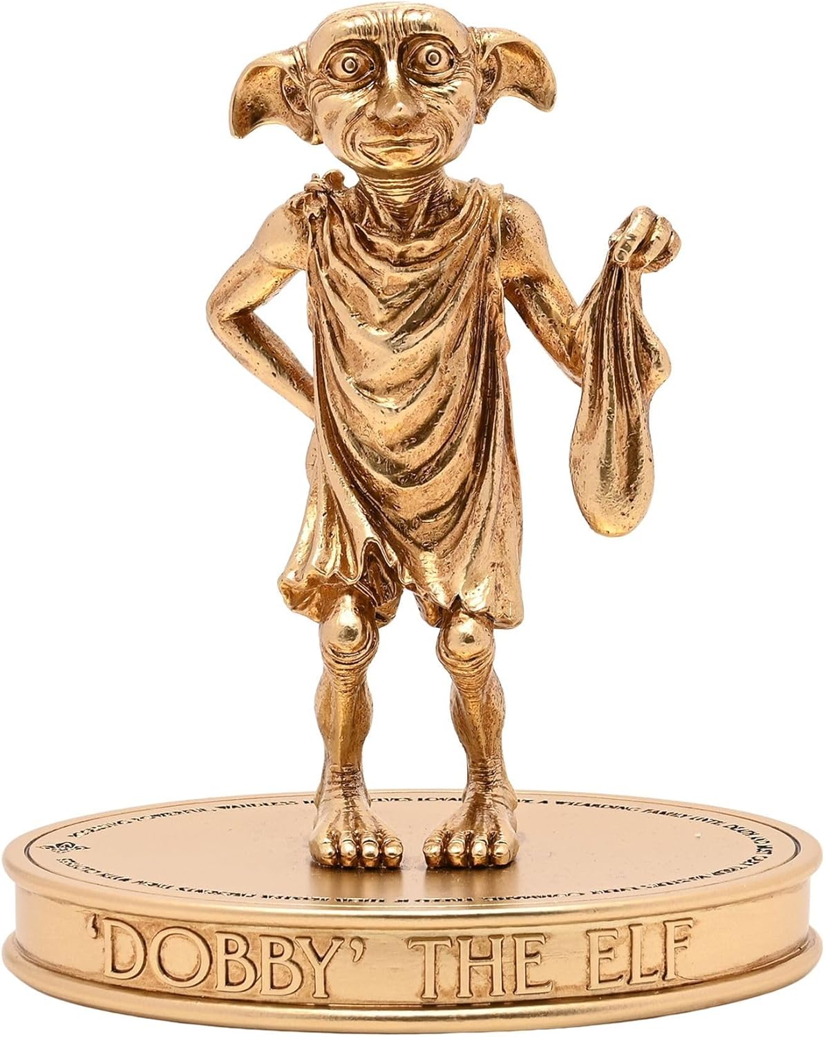 Gold figurine of Dobby the Elf on a white background