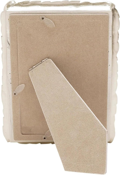 The back view of a square picture frame with a beige cardboard insert and a hinged support tab, shown on a plain white background.