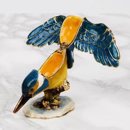 Decorative figurine of a bird with blue and yellow colors on a white background