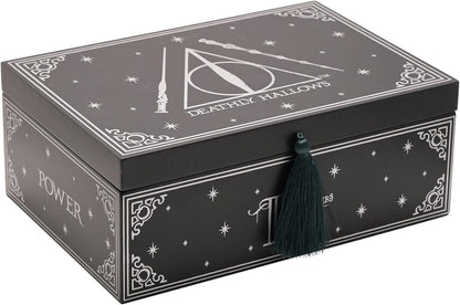 Decorative black box with white designs and text, featuring a tassel on a white background.