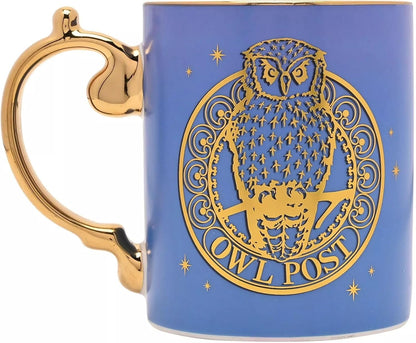 A blue ceramic mug with a metallic gold handle and a gold owl emblem reading 'OWL POST' on the side, shown against a plain white background.
