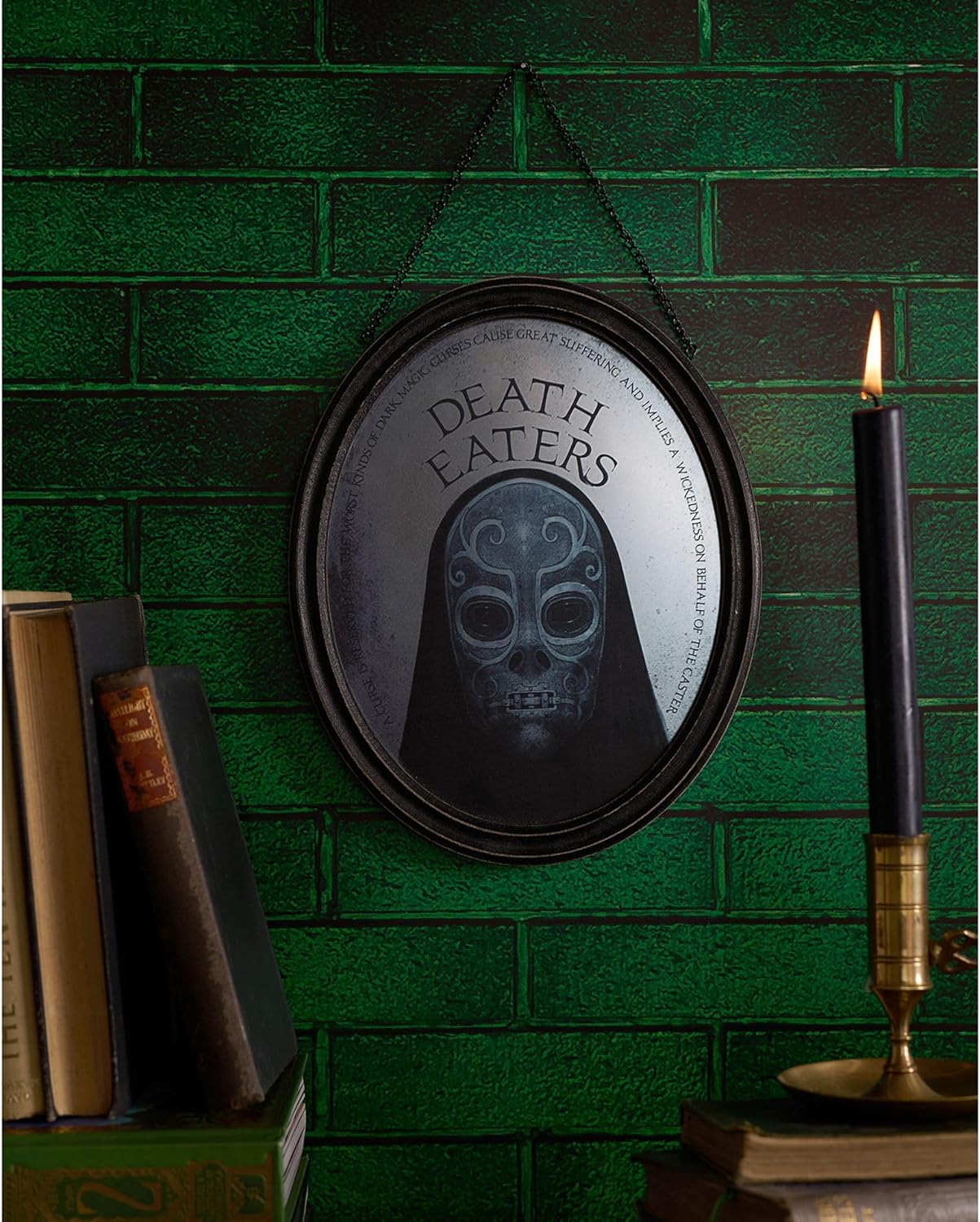 Decorative sign with 'Death Eaters' text and skull design on a green brick wall.