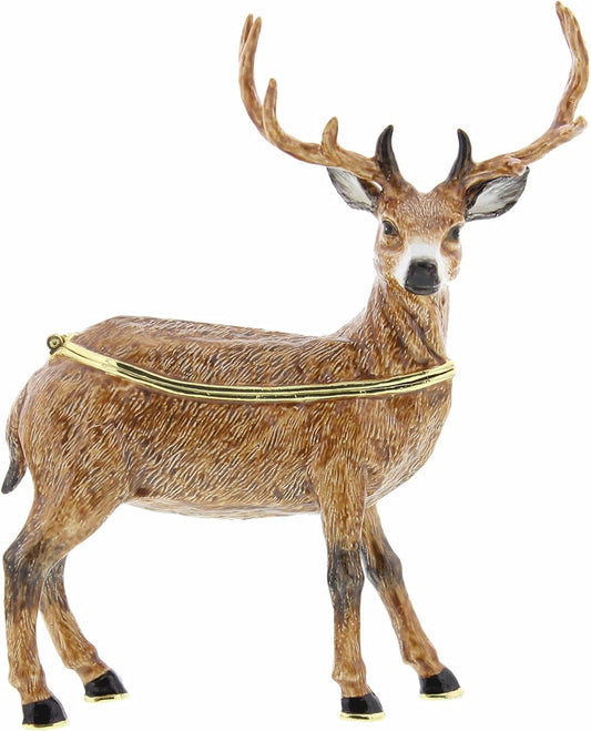 Deer figurine with gold harness on a white background