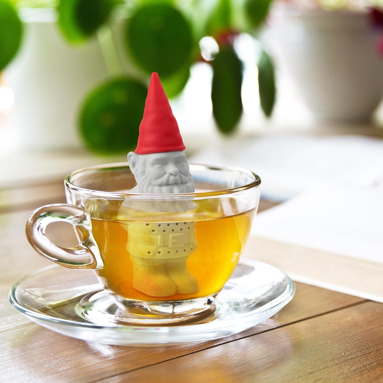 Gnome-shaped silicone baking mold with red hat and measurements, Fred brand visible