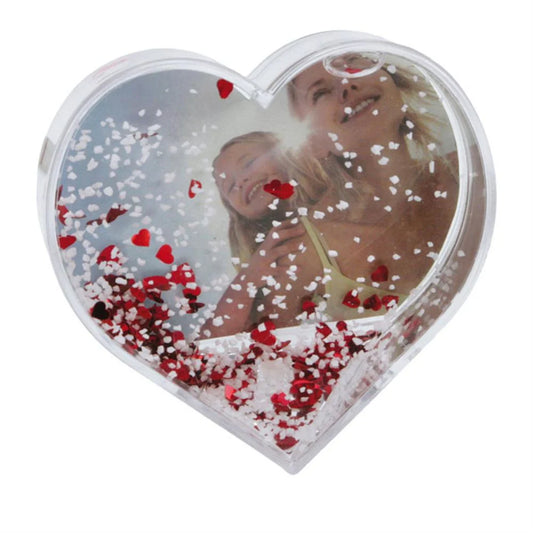 Heart-shaped photo frame with a couple and confetti on a white background