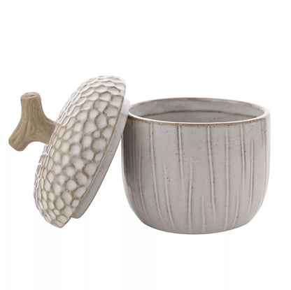 Gray ceramic container with textured lid on a white background