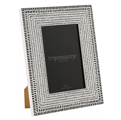 Black and white patterned photo frame with 'Impressions' branding on a white background