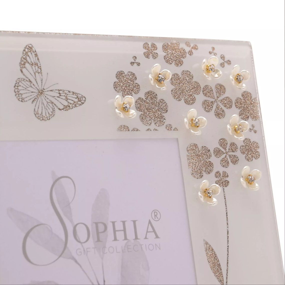 Decorative product with floral and butterfly designs on a white background, featuring the brand 'SOPHIA'.