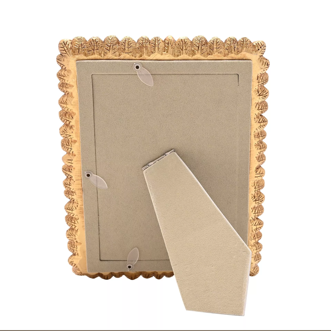 Decorative gold frame with a cardboard backing on a white background
