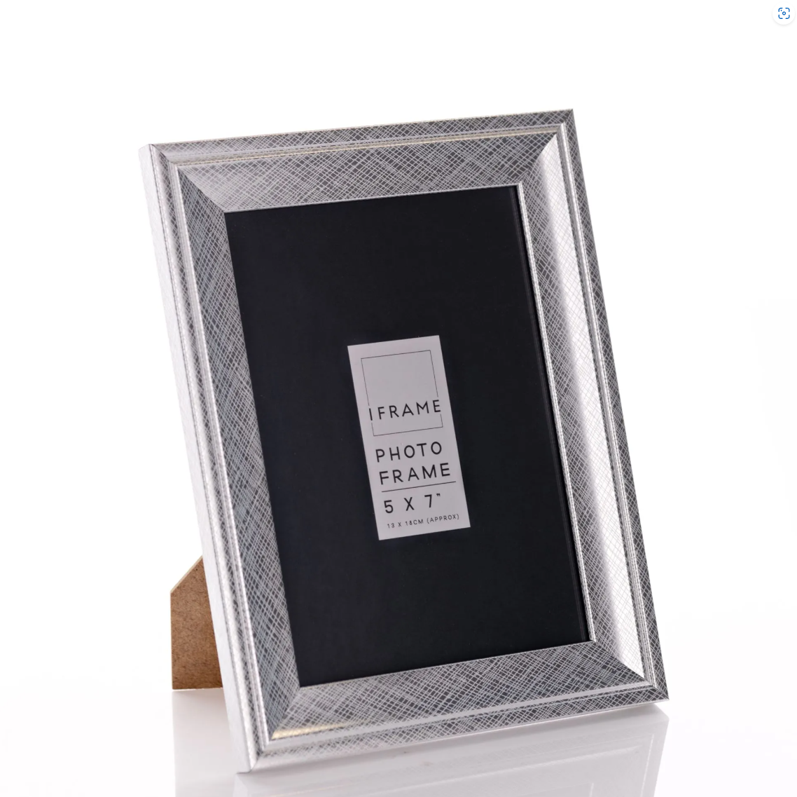 Silver photo frame with geometric pattern on a white background