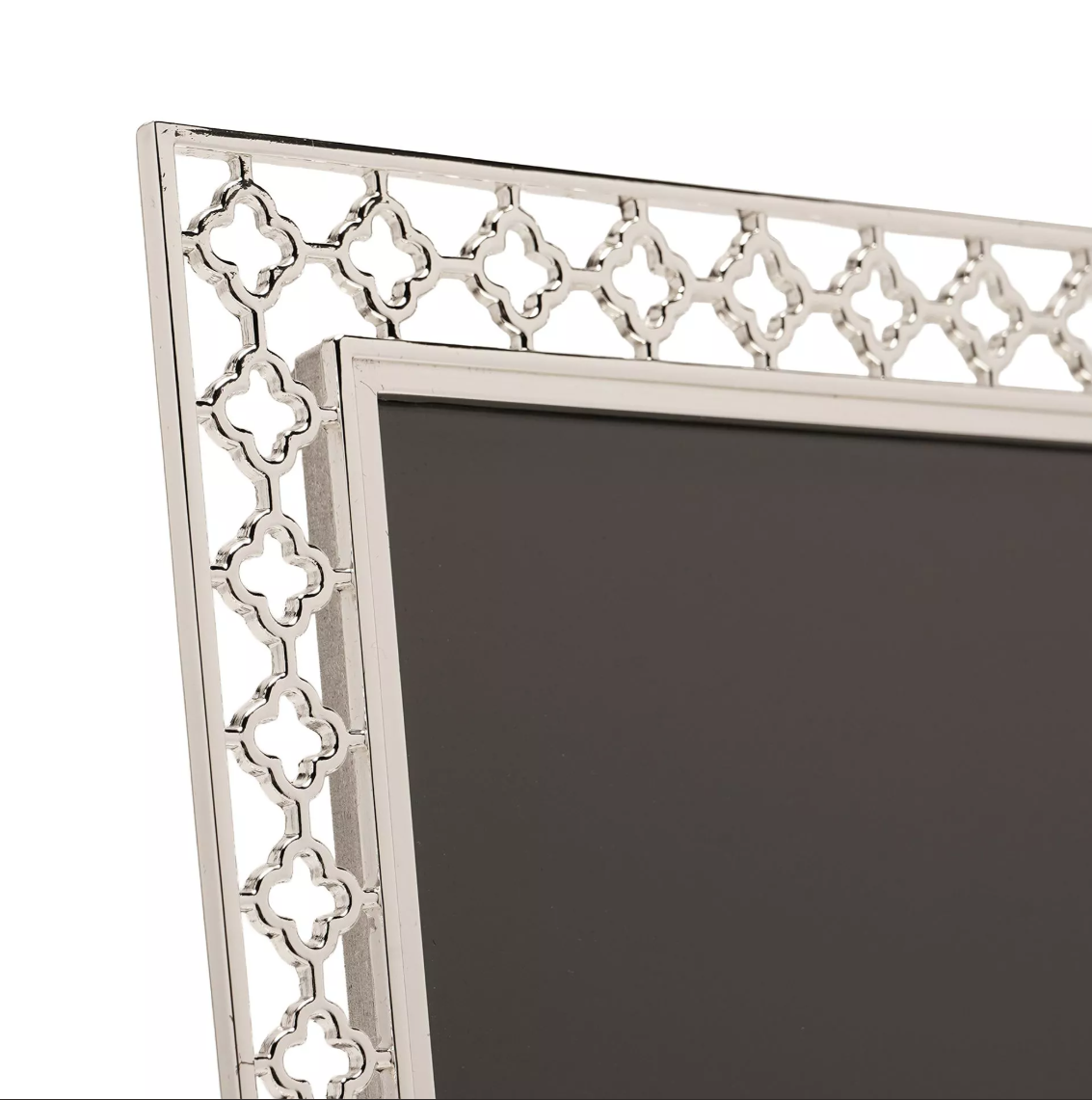 Decorative silver frame with intricate patterns on a white background