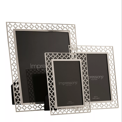 Set of three silver photo frames with 'Impressions' branding on a white background