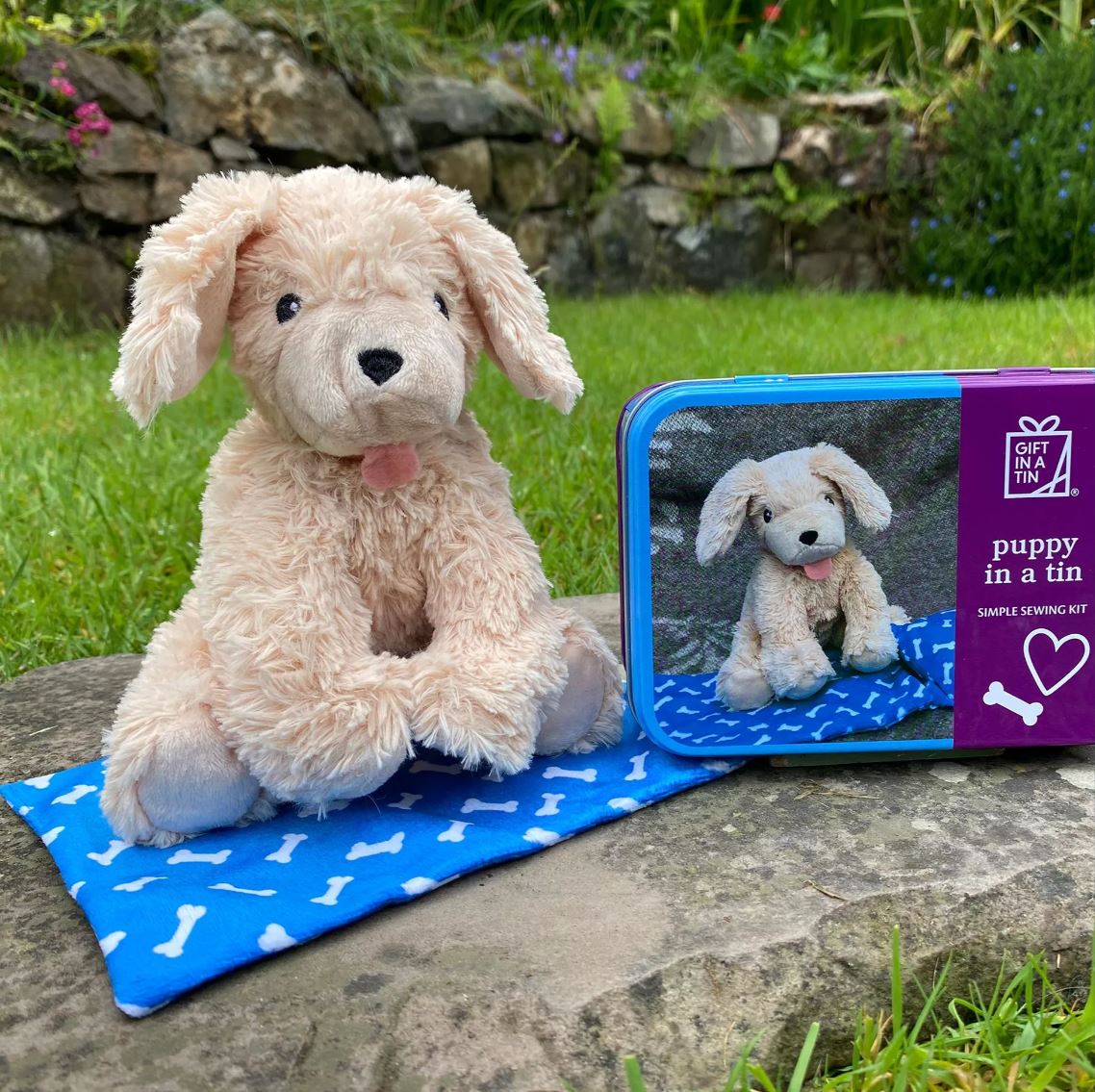 Apples To Pears Gift In A Tin Puppy shown made puppy next to the tin