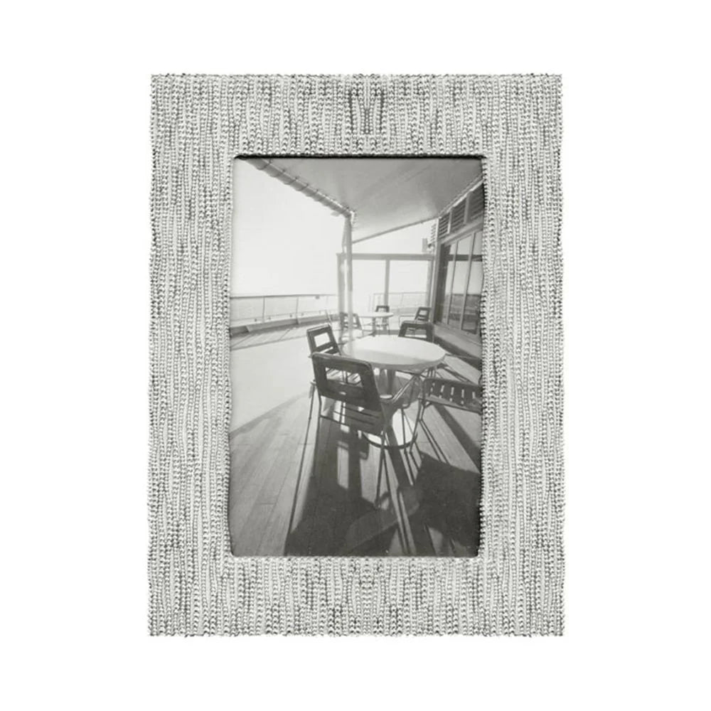 Decorative photo frame with a textured border