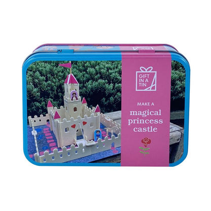 Toy castle set in a tin with packaging text 'Make a magical princess castle'.