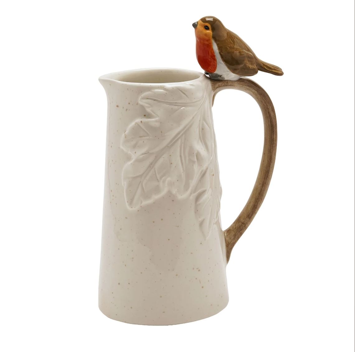 A speckled cream-colored ceramic pitcher with a raised leaf design on the front, a brown handle, and a small robin bird figurine perched on the rim, shown against a plain white background.