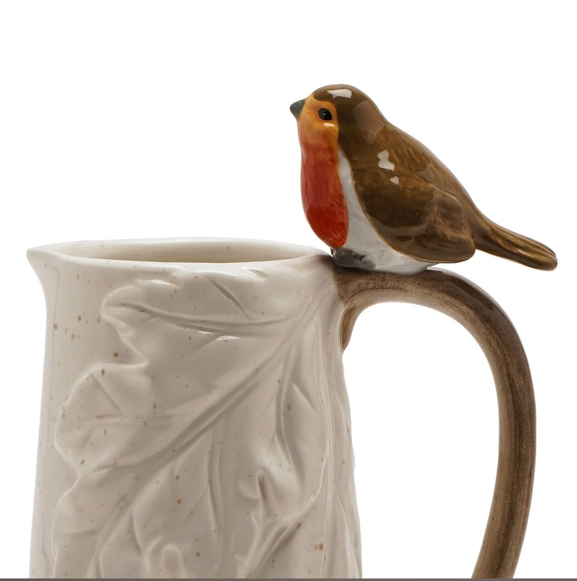 A ceramic mug with a leaf-textured body and a curved handle, topped with a small bird figurine in brown, white, and orange-red tones, shown on a white background.