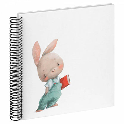 Notebook with a cute illustration of a rabbit holding a book on the cover