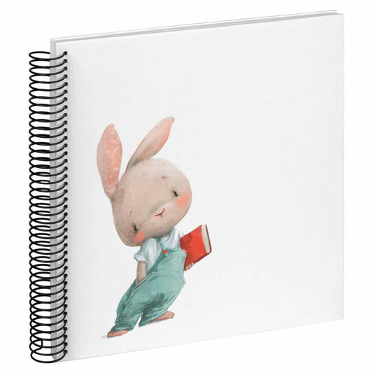 Notebook with a cute illustration of a rabbit holding a book on the cover