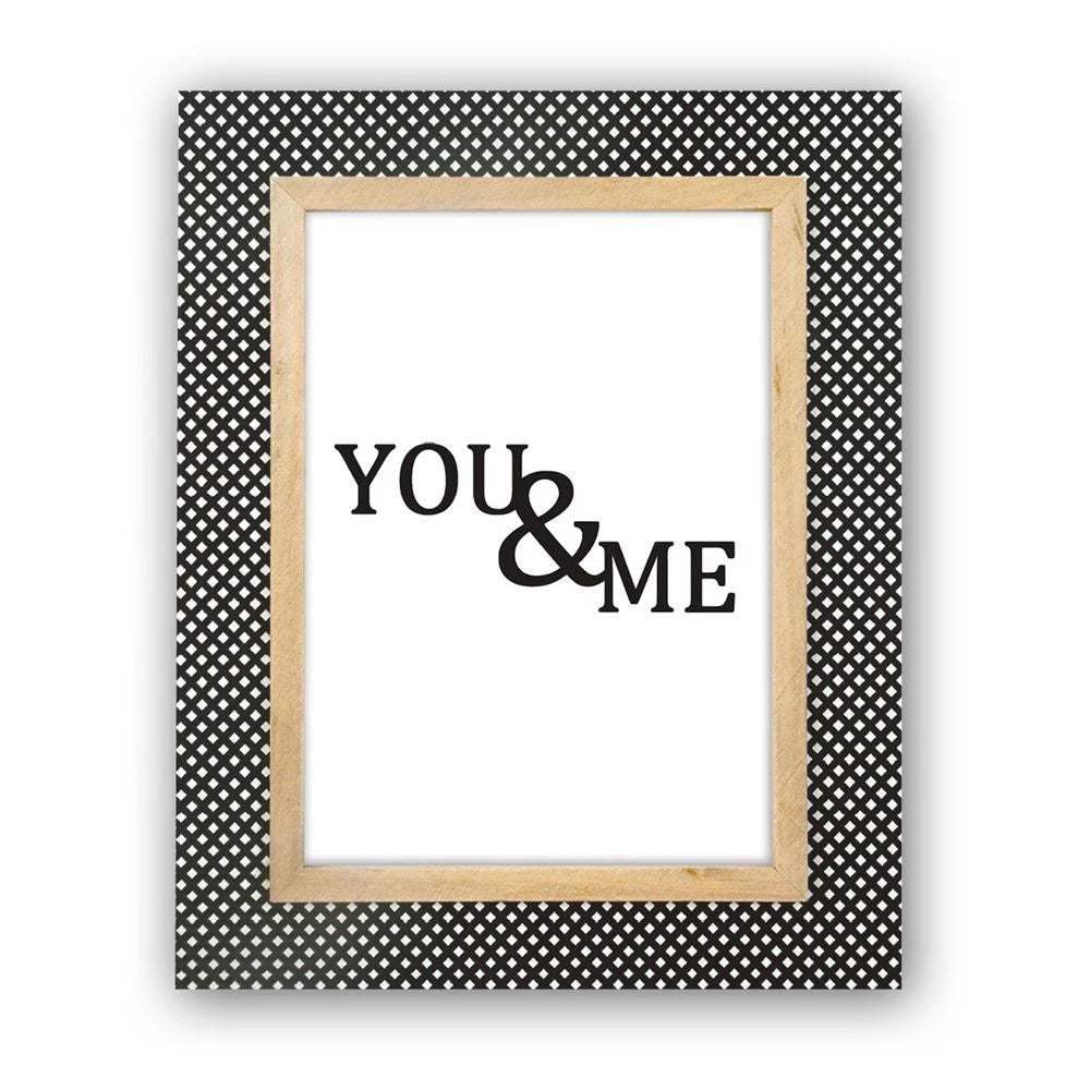 Framed artwork with 'YOU & ME' text on a polka dot background